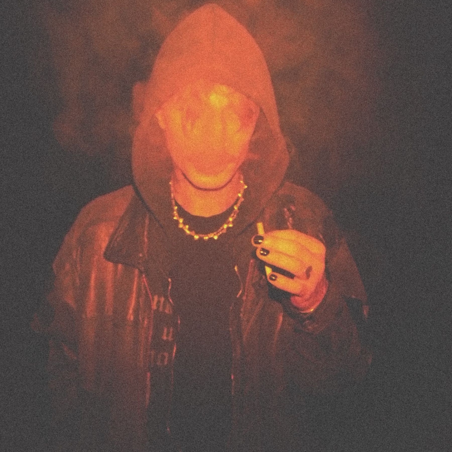 Man with hood smoking