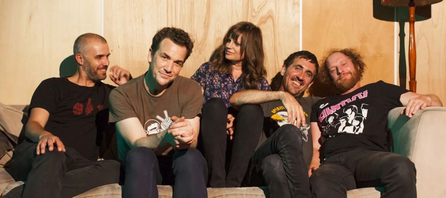Five people sitting on a couch
