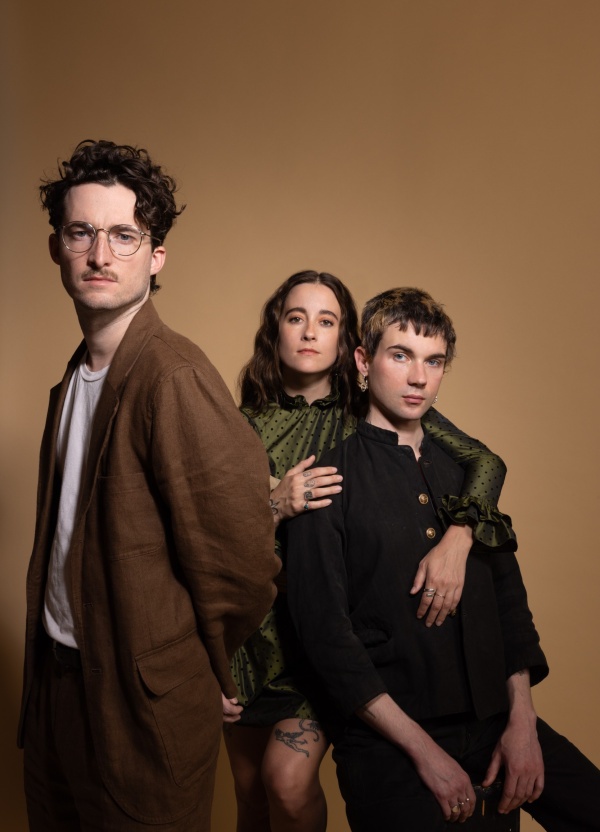 3 people sitting in a cinema, red